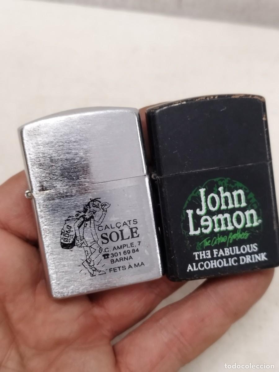 Mecheros: 2 mecheros, encendedores tipo Zippo, publicidad cal&ccedil;ats Sole, John Lemon. Sin probar.