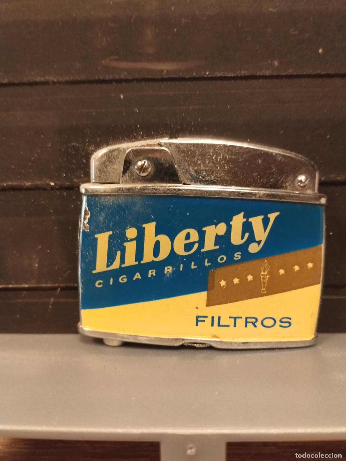 Briquets: SEV M49 MECHERO PUBLICIDAD. LIBERTY CIGARRILLOS. FALTAS EN EL ESMALTE. VER FOTOS.