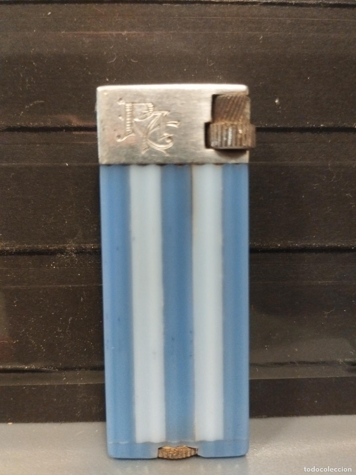 Briquets: SEV M38 MECHERO R.A. AZUL CLARO TRASLUCIDO. BUENA CALIDAD. VER FOTOS.