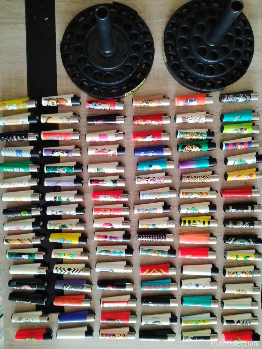 Mecheros: Doble expositor completo con 96 mecheros Clipper + 19 de regalo