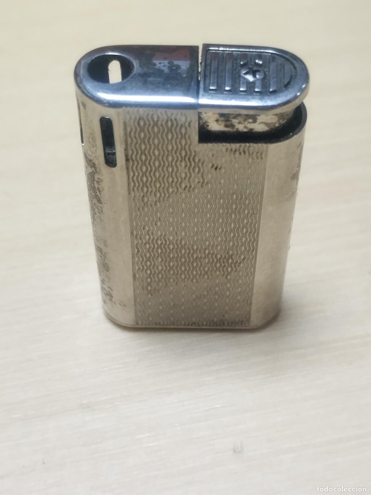 Briquets: BZB 175 MECHERO MARCA BISBON. MEDIDAS 4 CM * 2.5 CM . VER FOTOS ADJUNTAS.