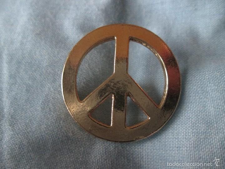 Pin's de collection: Pin simbolo paz dorado