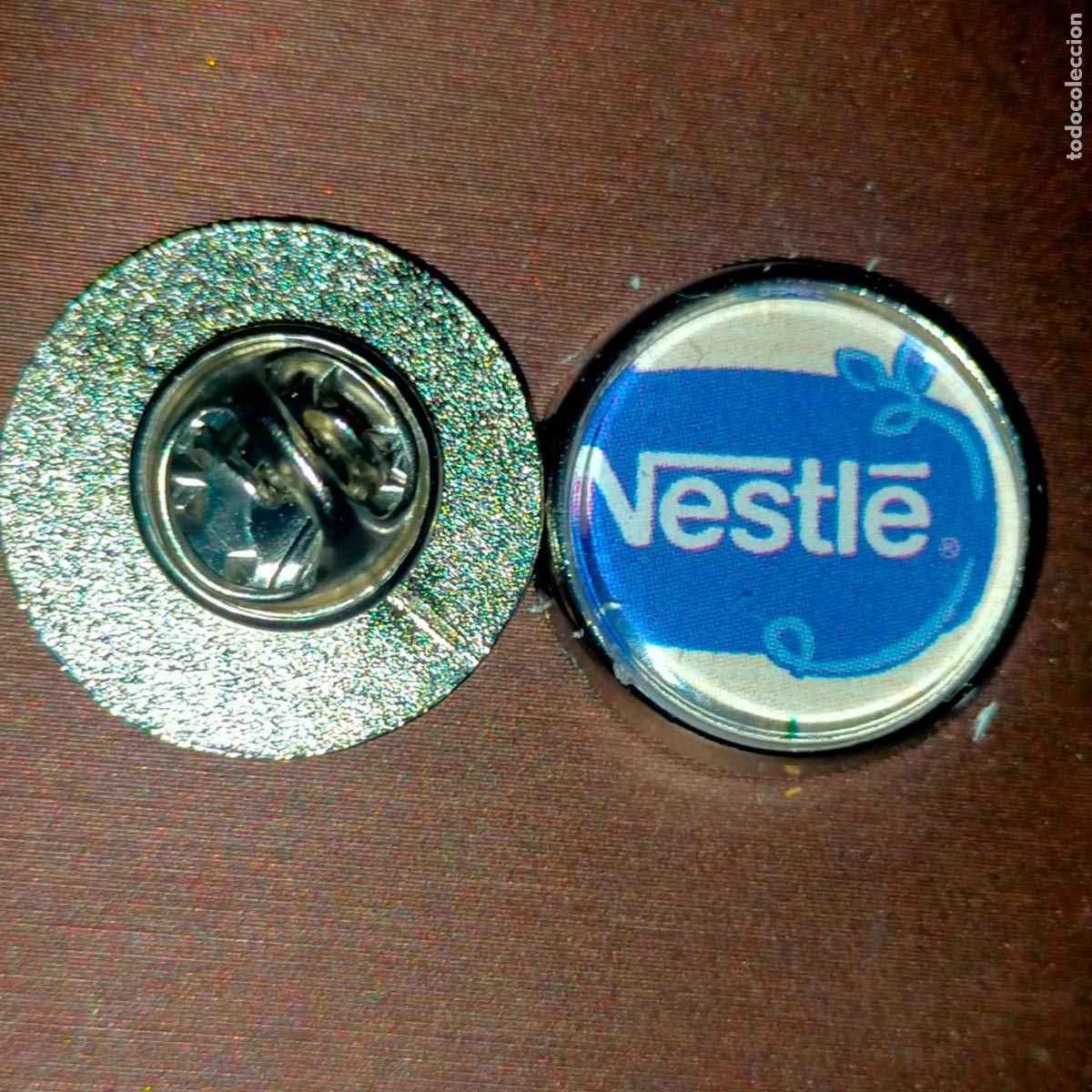 Pin's de collection: PIN REDONDO METAL - publicitario chocolates nestle