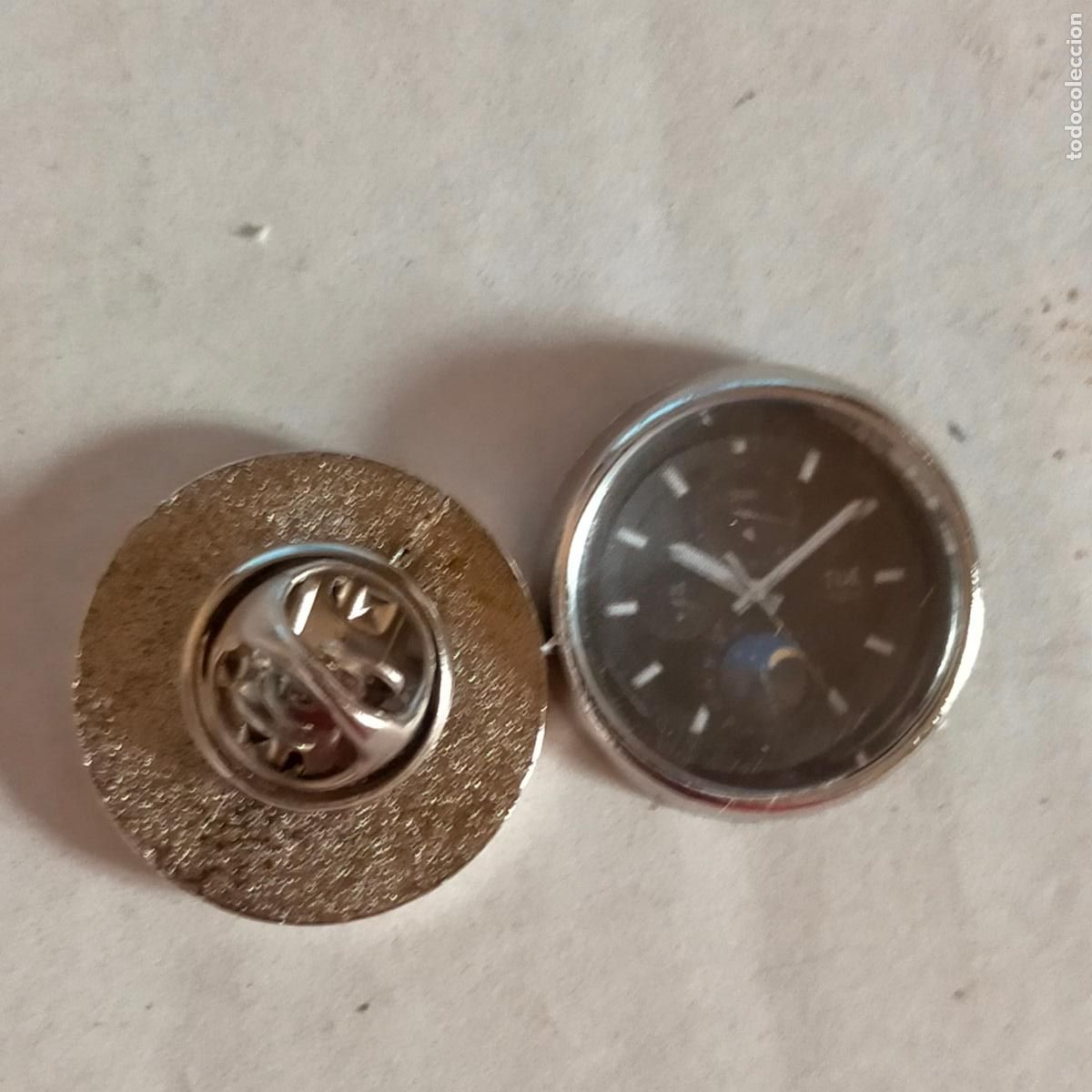 Pin's de collection: PIN REDONDO METAL - publicitario CON IMAGEN DE LA ESFERA DE UN RELOJ , VER MAS MODELOS
