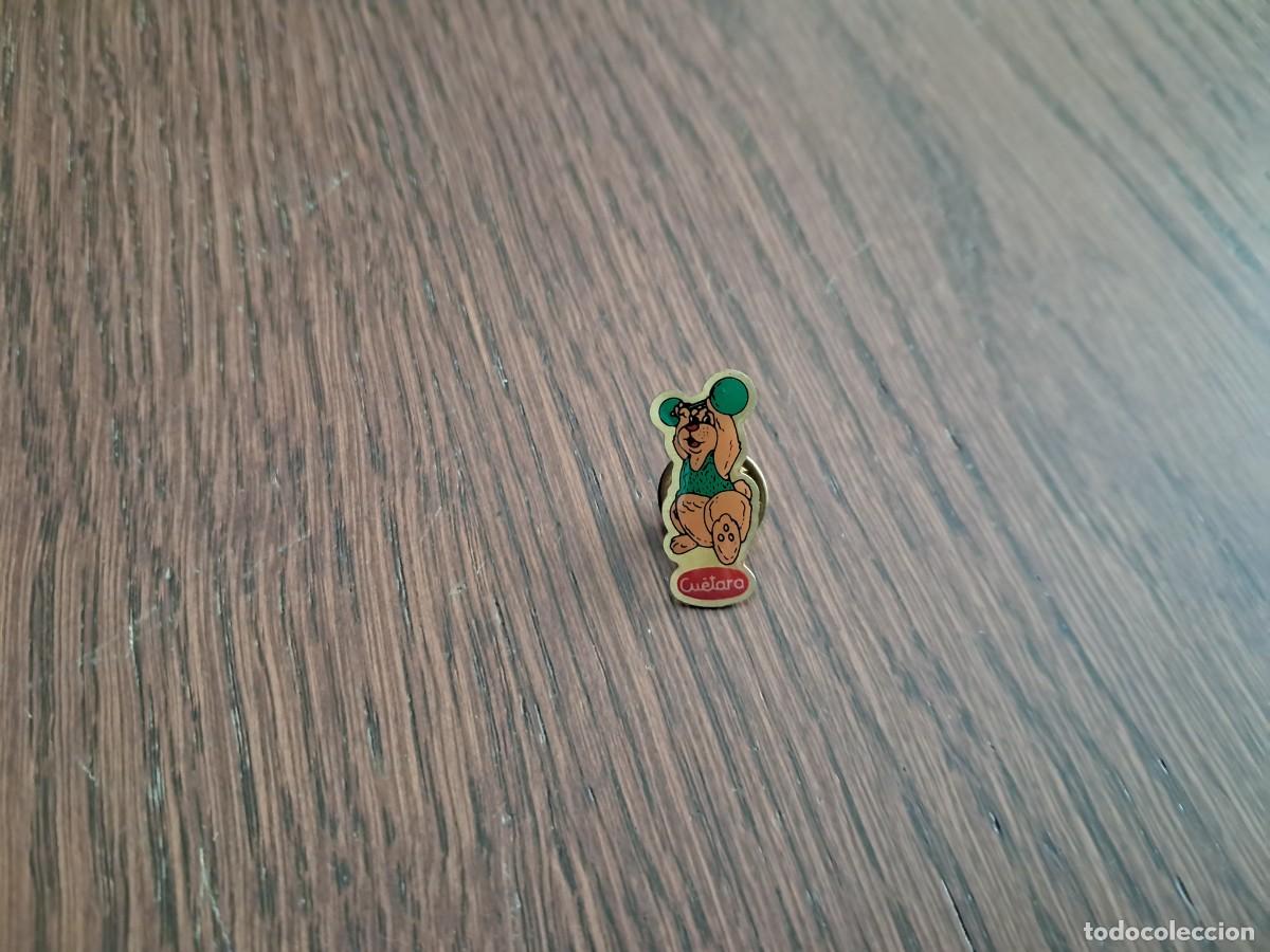 Sammlung von Pins: pin de publicidad, Cu&eacute;tara, deportes, levantamiento de pesas.