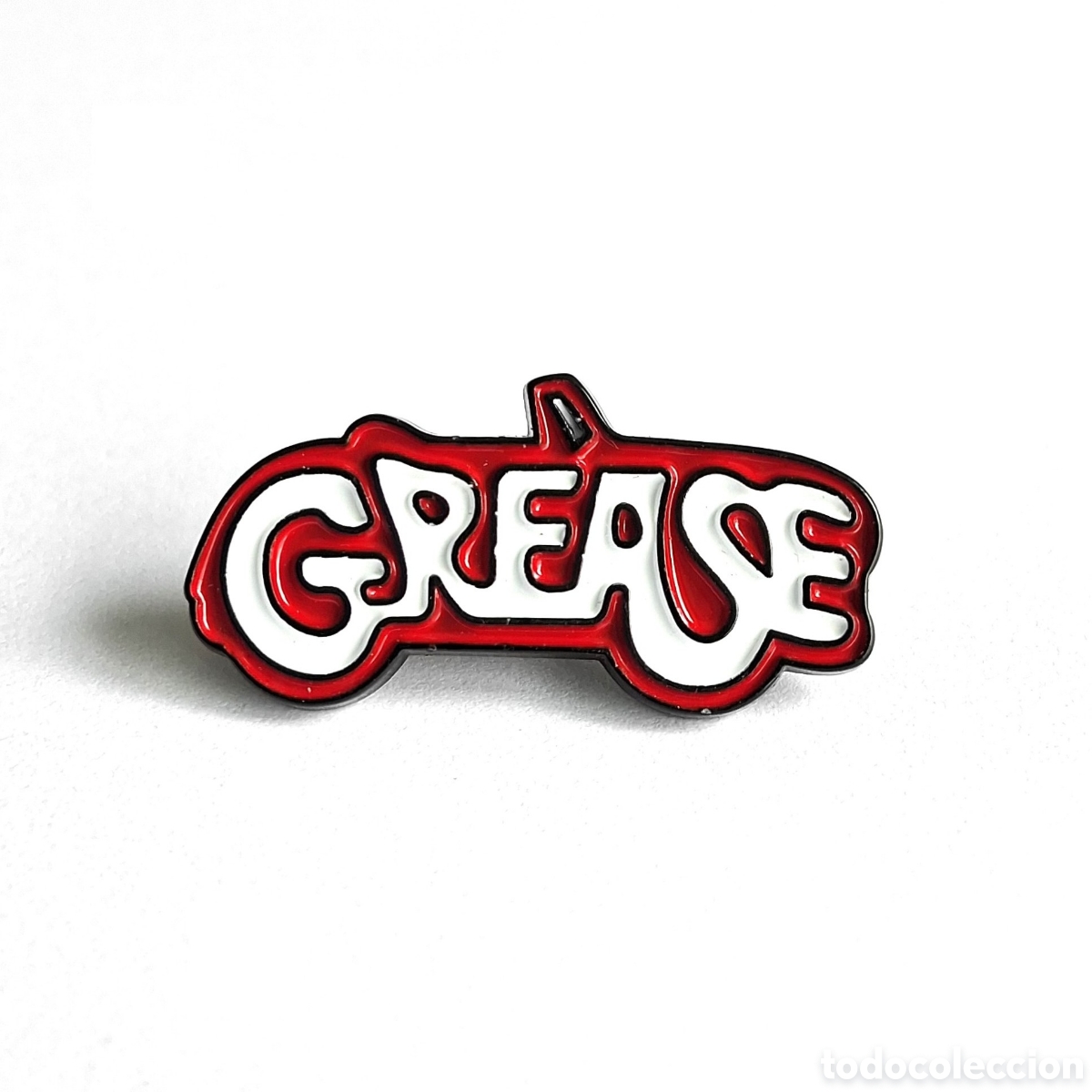 Pins de colecci&oacute;n: Pin met&aacute;lico logo &rdquo;Grease&rdquo;.