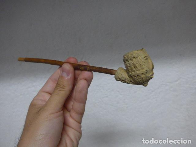 Pipas de fumar: Antigua pipa de fumar de terracota con rostro o cabeza de personaje, original.