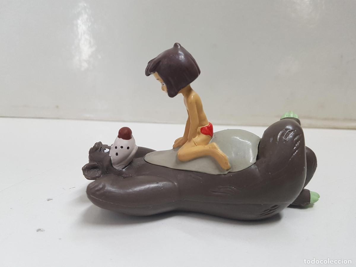 Collection Magazines and Newspapers: Figura pelicula Libro de la Selva: Mowgli sobre Baloo.