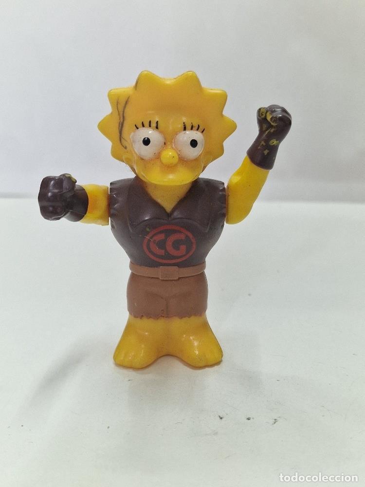 Collection Magazines and Newspapers: Figura pl&aacute;stico: Clobber Girl, una versi&oacute;n de Lisa Simpson como una superheroina - NULL