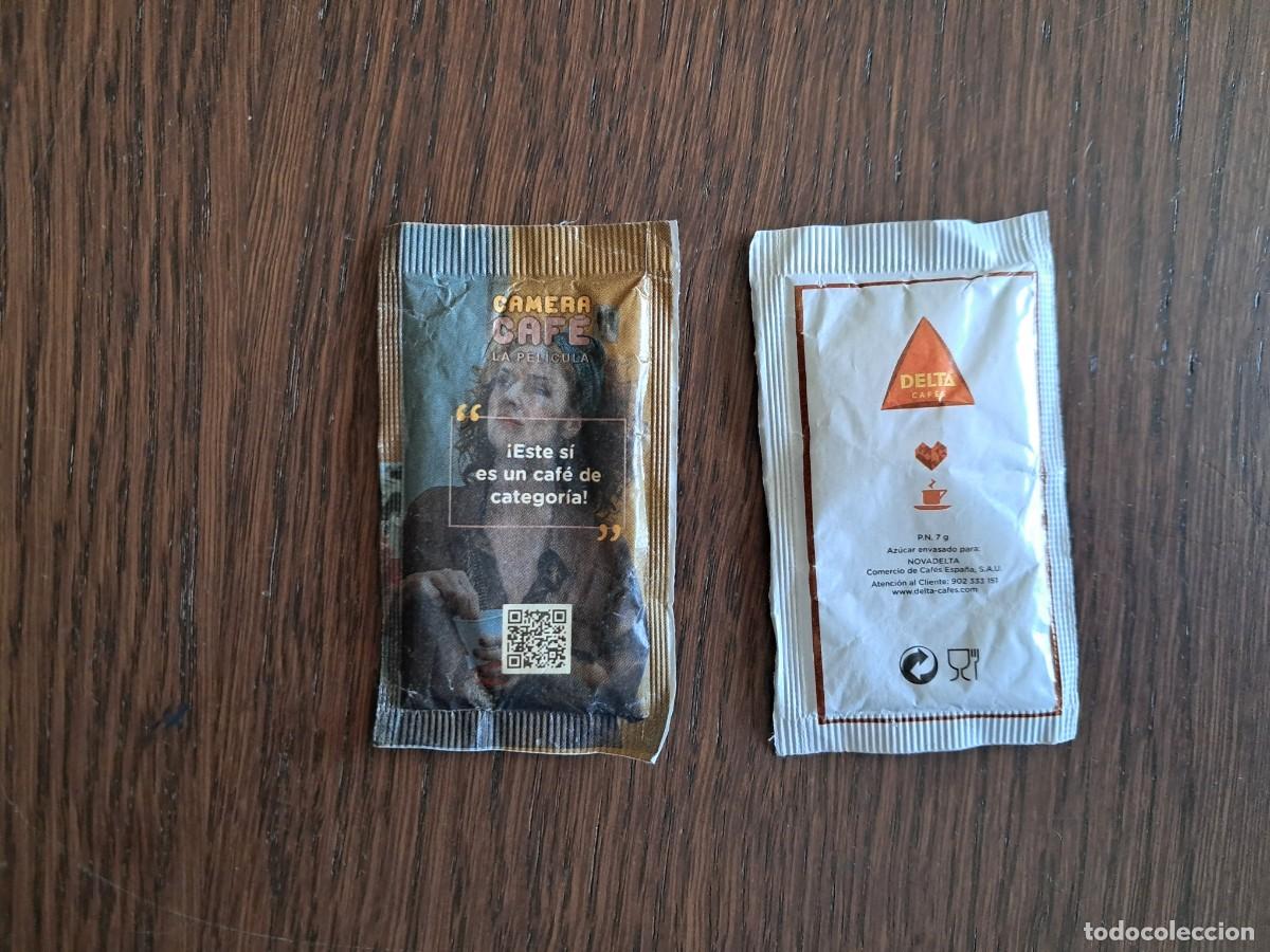 Sobres de az&uacute;car de colecci&oacute;n: sobre de az&uacute;car vac&iacute;o publicitario, camera caf&eacute;, la pel&iacute;cula. Delta caf&eacute;s.