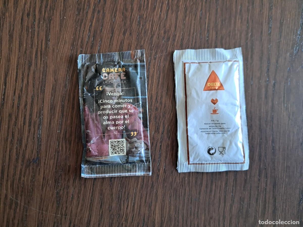 Sobres de az&uacute;car de colecci&oacute;n: sobre de az&uacute;car vac&iacute;o publicitario, camera caf&eacute;, la pel&iacute;cula. Delta caf&eacute;s.
