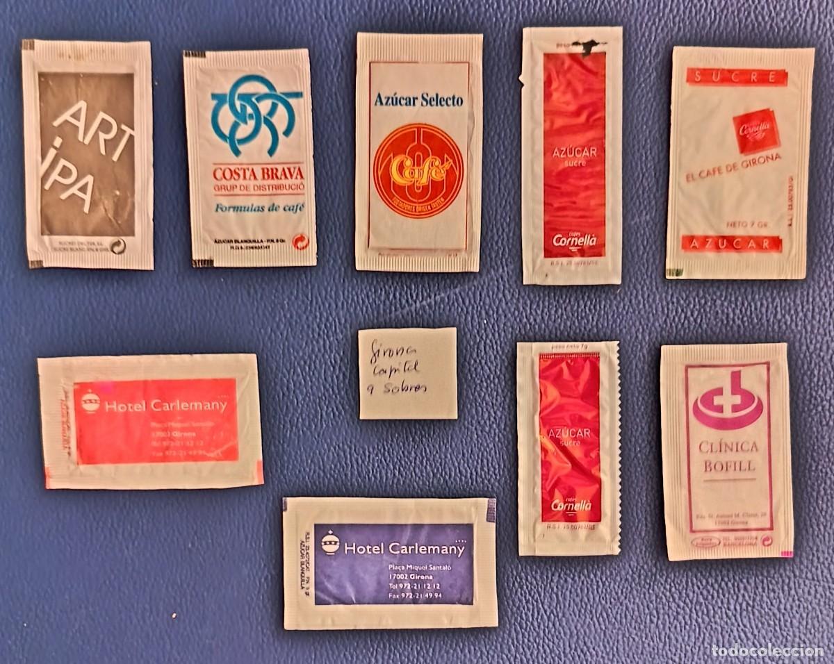 Sobres de az&uacute;car de colecci&oacute;n: Sobres de azucar. 9 Sobres de azucar. Capital o centro. Girona. Uno abierto como un libro.