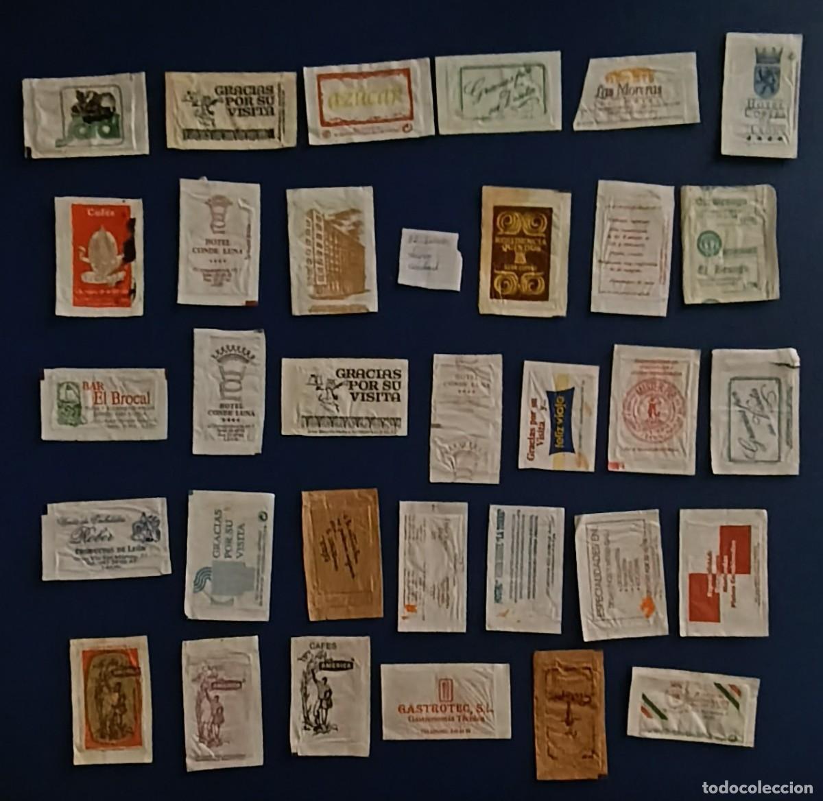 Sobres de az&uacute;car de colecci&oacute;n: Sobres de azucar. 32 Sobres de azucar. Leon ciudad. Uno abierto como un libro.