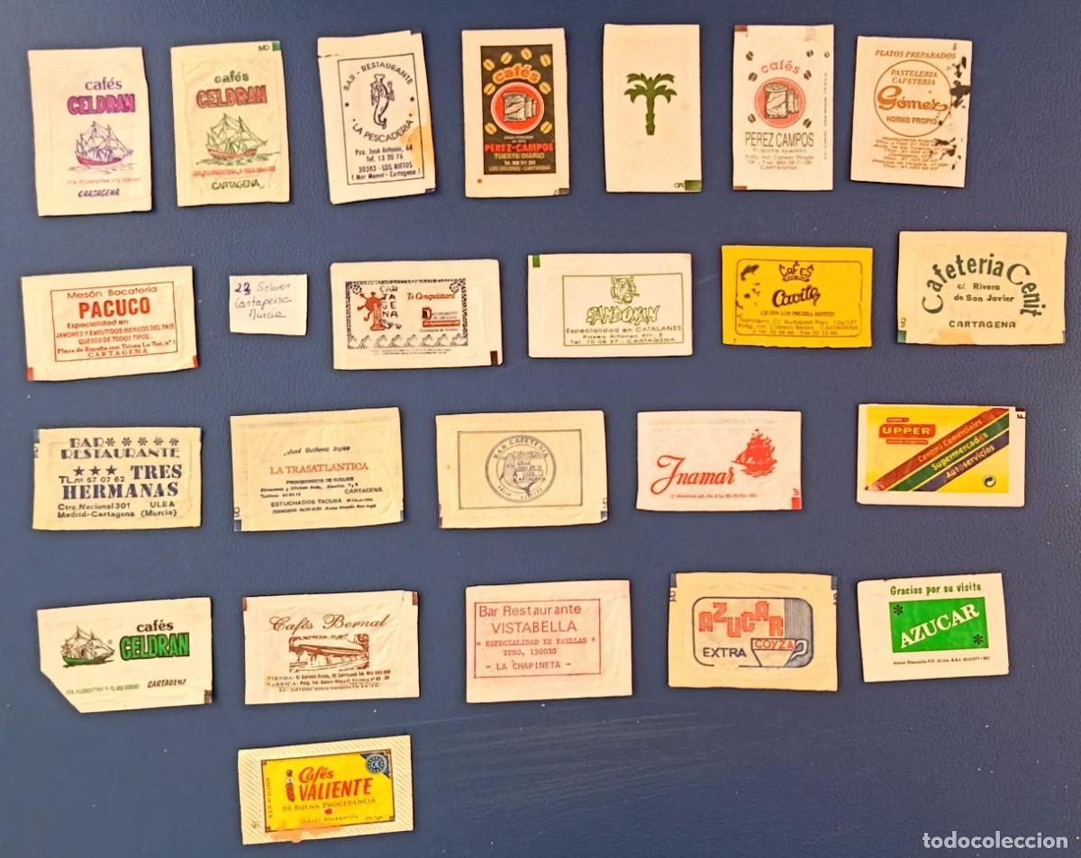 Sobres de az&uacute;car de colecci&oacute;n: Sobres de azucar. 23 Sobres de azucar. Cartagena. Murcia. Uno abierto como un libro.