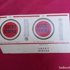 Paquetes de tabaco: LUCKY STRIKE. 20 CIGARETTES. MADE IN USA.