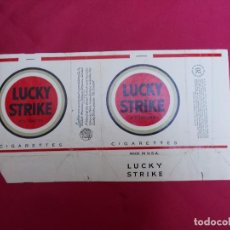 Paquetes de tabaco: LUCKY STRIKE. 20 CIGARETTES. MADE IN USA.