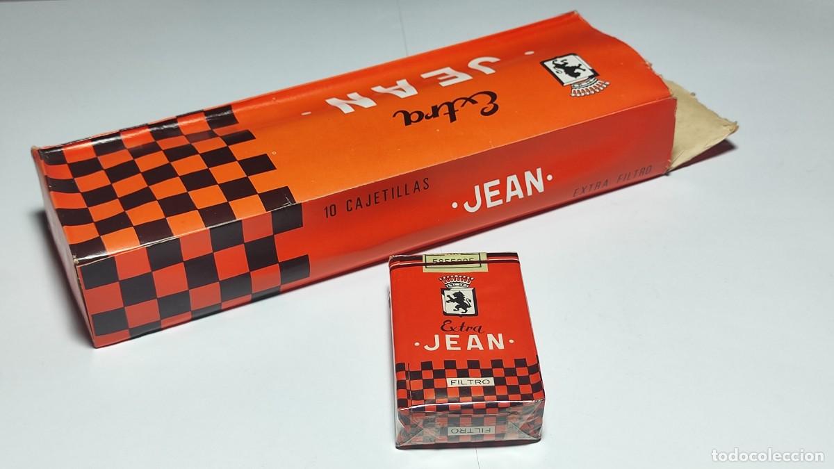 Paquetes de tabaco: Paquete + Cart&oacute;n vac&iacute;o tabaco JEAN extra. El paquete lleno y sin desprecintar, a&ntilde;os 70