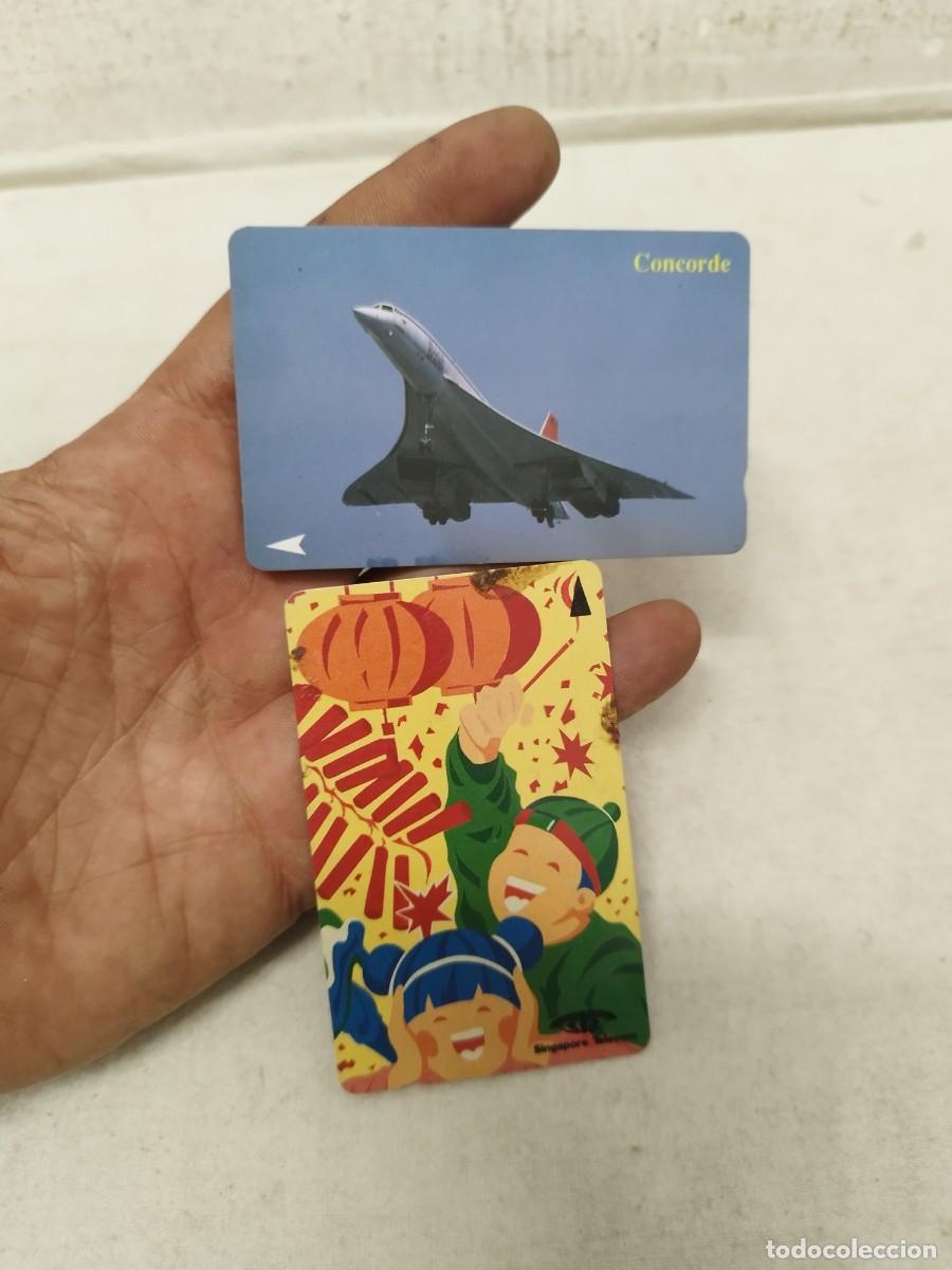 Tarjetas telef&oacute;nicas de colecci&oacute;n: Tarjeta telef&oacute;nica Simgapore telecom. Avi&oacute;n concorde, celebraci&oacute;n a&ntilde;o chino, farolillos.