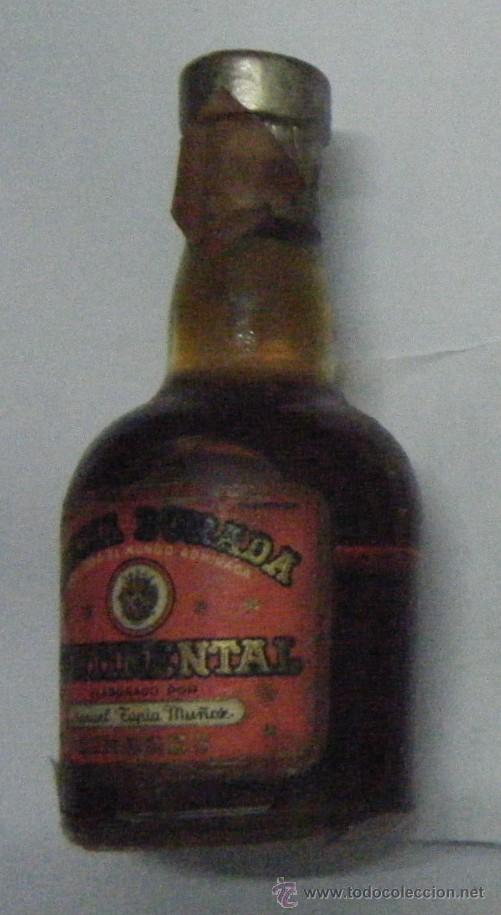 Coleccionismo de vinos y licores: BOTELLIN DE LICOR CREMA DORADA CONTINENTAL. DESTILERIAS CONTINENTAL   RF-169
