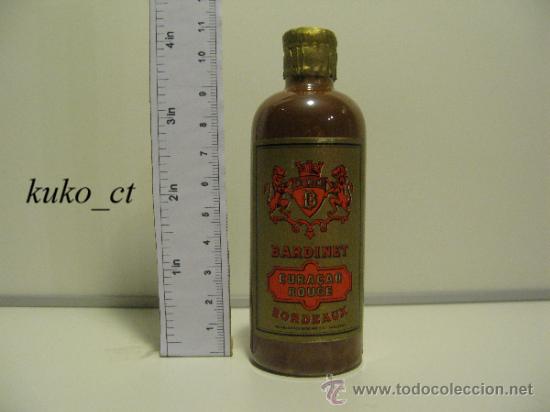 Collection of wines and liquors: Botellita licor cura&ccedil;ao bordeaux