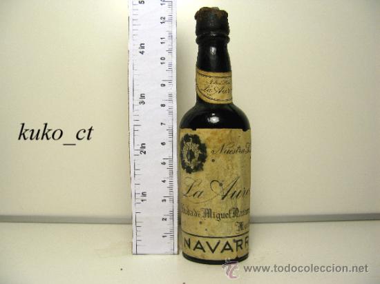 Collection of wines and liquors: BOTELLITA BOTELLIN NUESTRA SE&Ntilde;ORA DE LA AURORA VIUDA DE MIGUEL NAVARRO BODEGAS NAVARRO MONTILLA