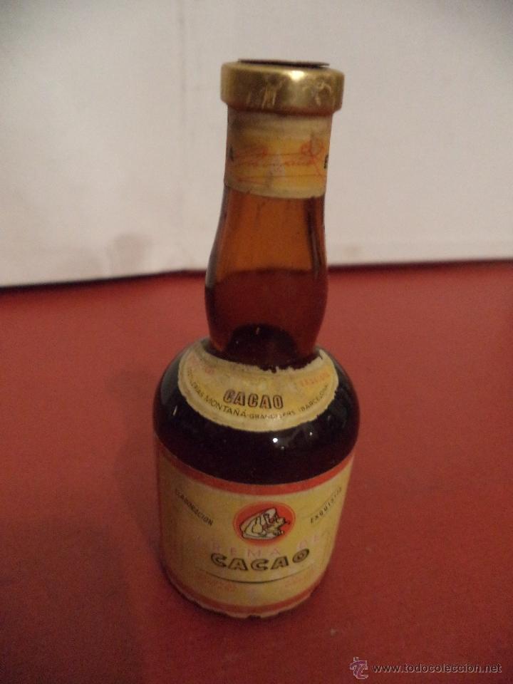 Coleccionismo de vinos y licores: BOTELLIN DE CREMA DE CACAO. DESTILER&Iacute;AS MONTA&Ntilde;A GRANOLLERS - BARCELONA.