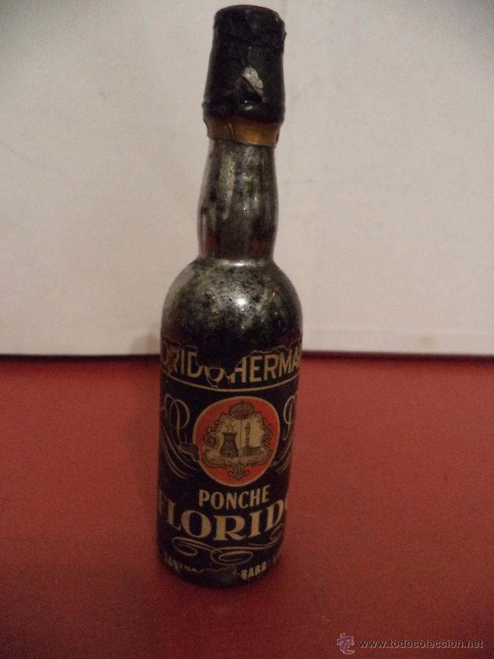 Collection of wines and liquors: BOTELLIN DE PONCHO FLORIDO. BODEGAS FLORIDO HERMANOS. SANL&Uacute;CAR DE BARRAMEDA.