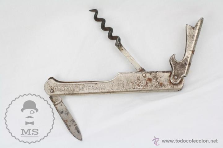 Coleccionismo de vinos y licores: Antiguo Abridor / Abrebotellas de Metal - Brandy Veterano Osborne -Medidas 12 Cm Largo - Sacacorchos