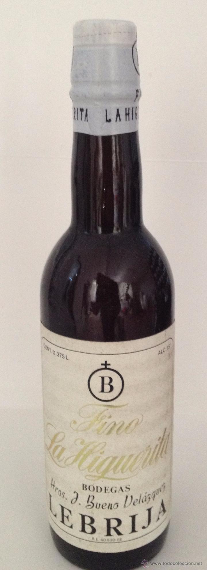 Coleccionismo de vinos y licores: BOTELLA DE FINO LA HIGUERITA. BODEGAS HNOS. J. BUENO VEL&Aacute;ZQUEZ. LEBRIJA. 25CM DE ALTO.