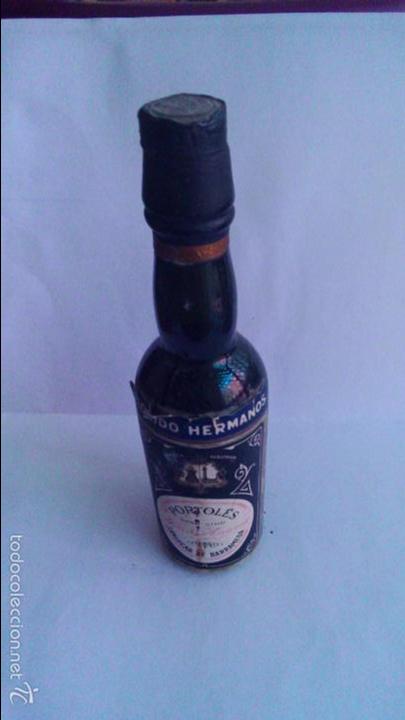 Coleccionismo de vinos y licores: BOTELLIN PORTOLES. FLORIDO HERMANOS. SANLUCAR DE BARRAMEDA.