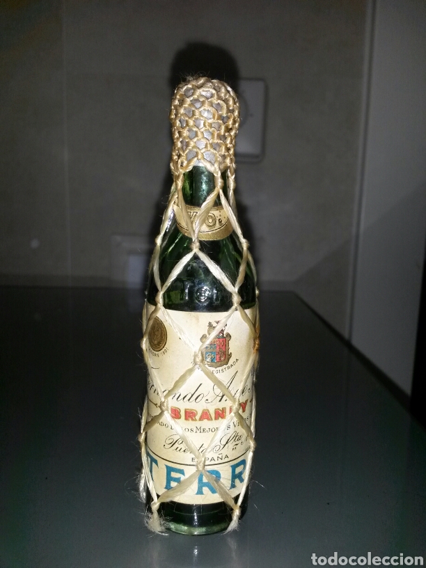 Coleccionismo de vinos y licores: ANTIGUO BOTELLIN TERRY CO&Ntilde;AC SELLO 4Cts LLENA