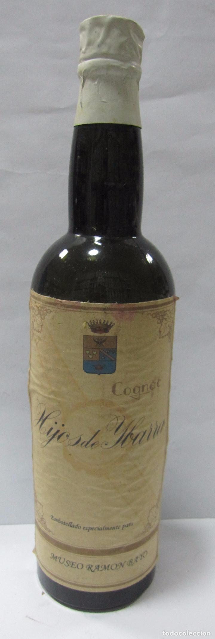 Coleccionismo de vinos y licores: BOTELLA DE MUESTRA DE COGNAC. HIJOS DE YBARRA. EMBOTELLADO PARA MUSEO RAMON BAYO. VAC&Iacute;A
