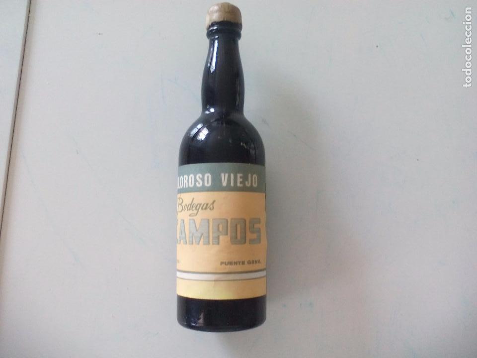 Coleccionismo de vinos y licores: Antigua botella o botellin de cristal en minaitura. Oloroso viejo, bodegas Campos. Puente Genil
