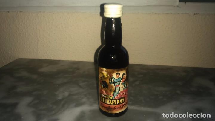 Coleccionismo de vinos y licores: Antigua Botella vino en miniatura quitapenas hijos de Jos&eacute; Su&aacute;rez villalba M&aacute;laga