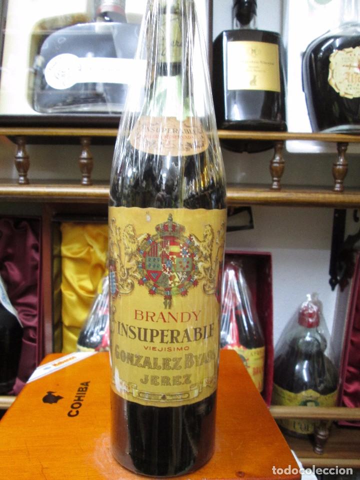 Coleccionismo de vinos y licores: ANTIGUA BOTELLA DE BRANDY CO&Ntilde;AC, INSUPERABLE VIEJISIMO IMPUESTO DE 80 CTS, DECADA A&Ntilde;OS 50-60