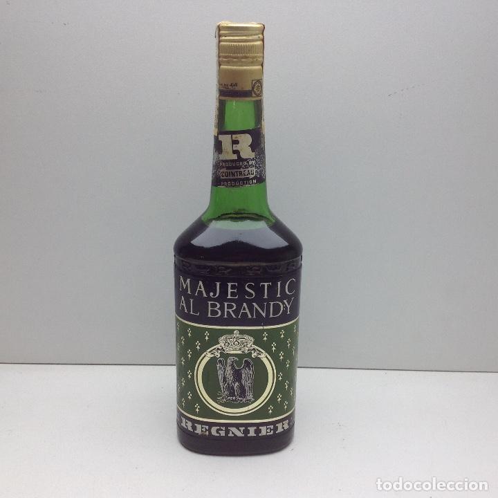 Collection of wines and liquors: ANTIGUA BOTELLA MAJESTIC AL BRANDY - REGNIER -FABRICADA POR COINTREAU EN VILAFRANCA DEL PANADES