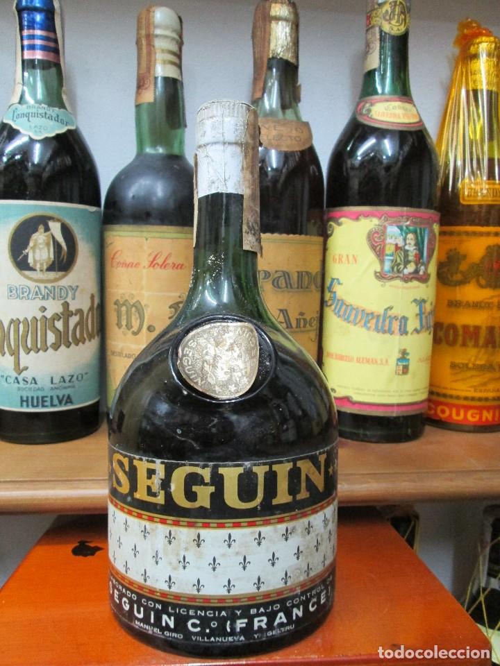 Coleccionismo de vinos y licores: ANTIGUA BOTELLA BRANDY CO&Ntilde;AC,SEGU&Igrave;N BRANDY IMPUESTO DE 80 CTS. DECADA 50-60