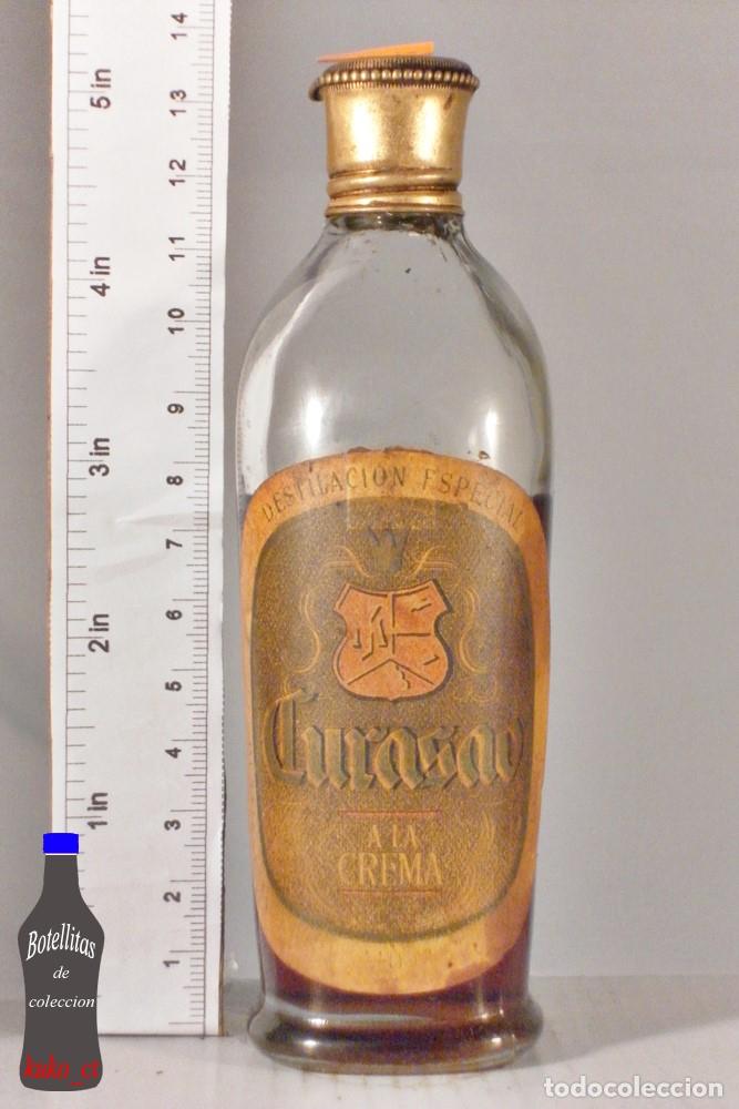 Sammlung von Weinen und Lik&ouml;ren: BOTELLITA BOTELLIN CURASAO A LA CREMA DESTILACION ESPECIAL DESTILERIAS VILA MONTA&Ntilde;A