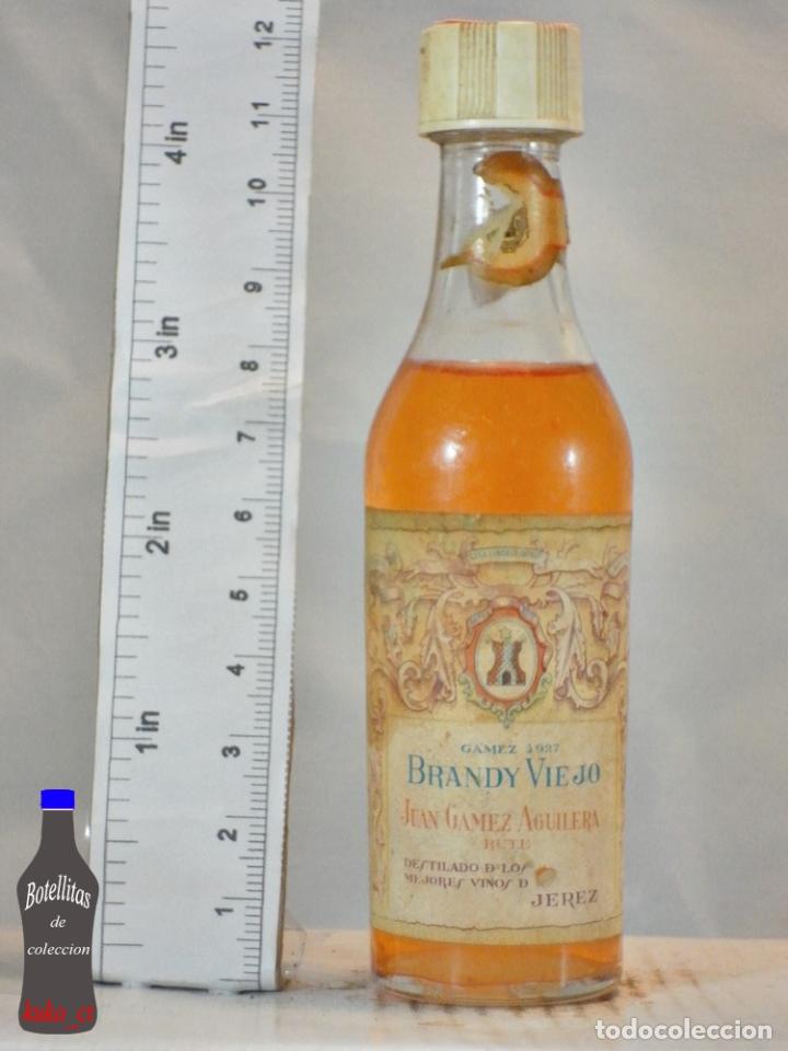 Coleccionismo de vinos y licores: BOTELLITA BOTELLIN BRANDY VIEJO 1927 JUAN GAMEZ AGUILERA RUTE JEREZ