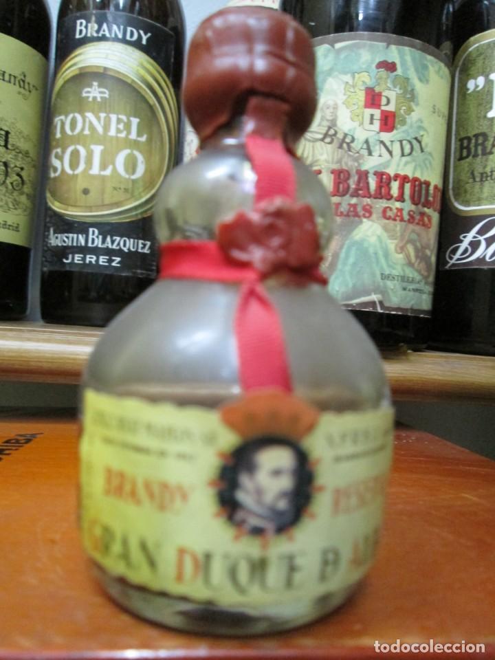 Coleccionismo de vinos y licores: ANTIGUO BOTELLIN BRANDY CO&Ntilde;AC, BRANDY GRAN DUQUE DE ALBA, RESERVA 9 CM ALTURA
