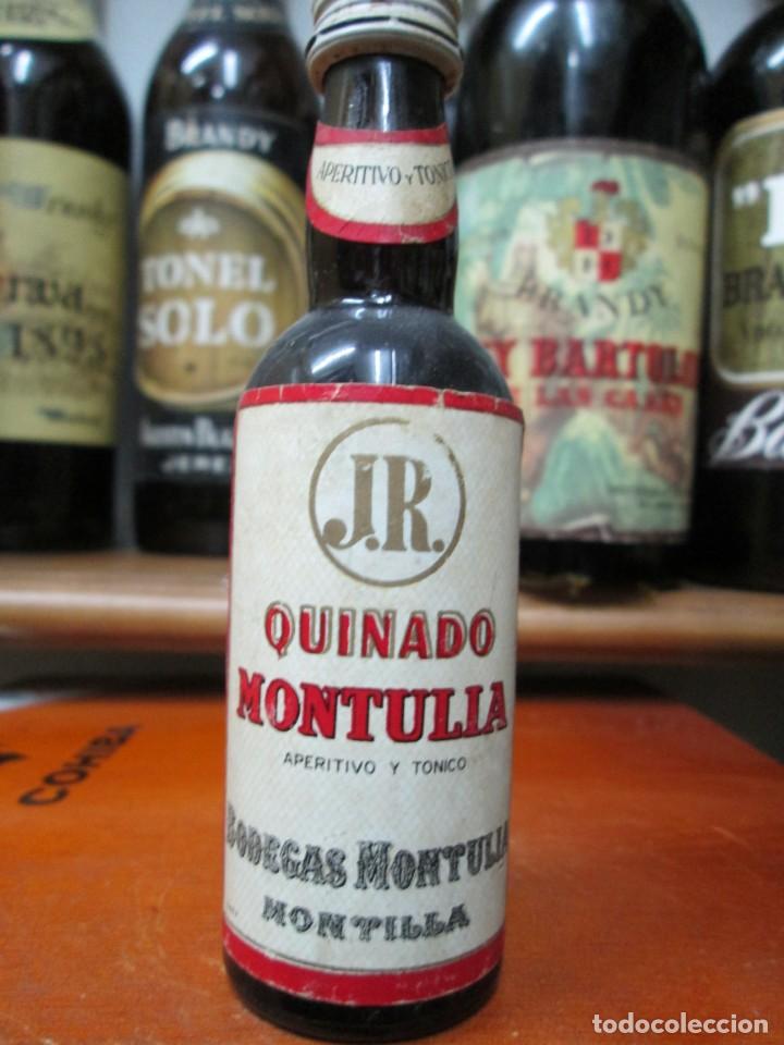Coleccionismo de vinos y licores: ANTIGUO BOTELLIN BRANDY CO&Ntilde;AC, QUINADO MONTULIA APERITIVO Y TONICO 11 CM ALTURA