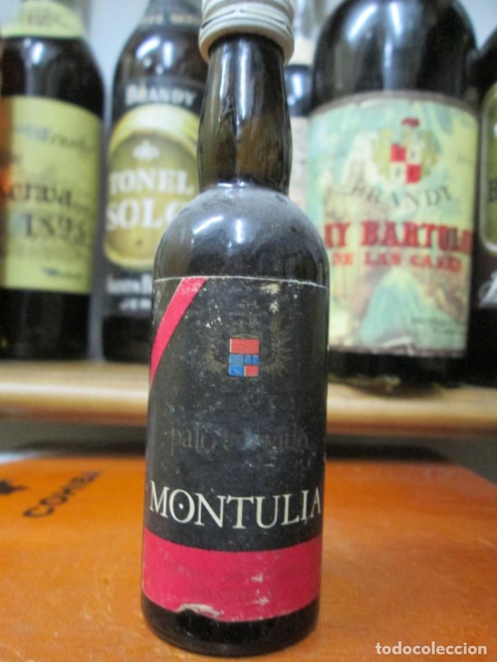 Coleccionismo de vinos y licores: ANTIGUO BOTELLIN BRANDY CO&Ntilde;AC, MONTULIA PALO CORTADO 12 CM ALTURA