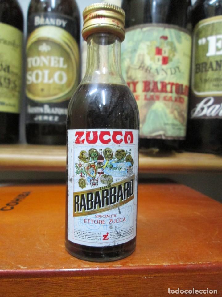 Coleccionismo de vinos y licores: ANTIGUO BOTELLIN BRANDY CO&Ntilde;AC, ZUCCO REBARBARO CUCCA ELIXIR 11 CM