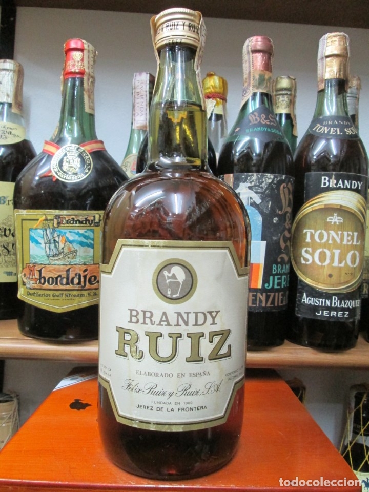 Coleccionismo de vinos y licores: ANTIGUA BOTELLA BRANDY CO&Ntilde;AC, RUIZ DE IMPUESTO DE 4 PTS. DECADA 60-70