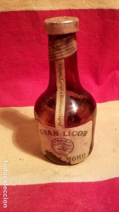 Coleccionismo de vinos y licores: BOTELLIN QUINA MOMO .