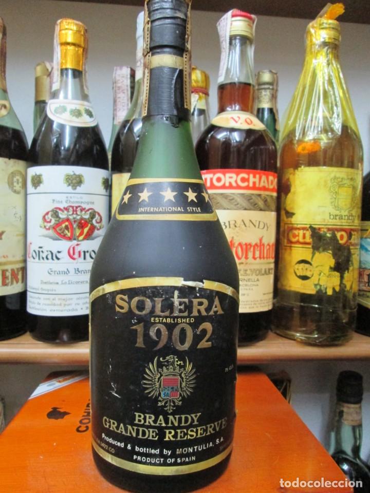 Coleccionismo de vinos y licores: ANTIGUA BOTELLA BRANDY CO&Ntilde;AC,1902 GRAN RESERVA DE IMPUESTO DE 4 PTS. DECADA 60-70