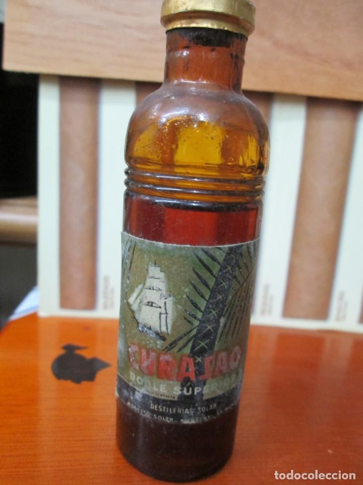 Collection of wines and liquors: ANTIGUO BOTELLIN, CURACAO DOBLE SUPERIOR, DESTILERIAS SOLER.