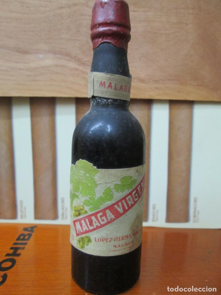Collection of wines and liquors: ANTIGUO BOTELLIN, MALA VIRGEN, DE LOPEZ HERMANOS MALAGA