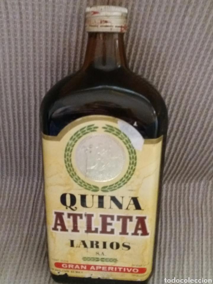 Coleccionismo de vinos y licores: BOTELLA QUINA ATLETA DE LARIOS GRAN APERITIVO
