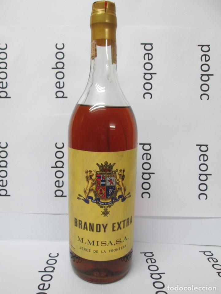 Coleccionismo de vinos y licores: ANTIGUA BOTELLA BRANDY CO&Ntilde;AC, EXTRA MISA, IMPUESTO DE 4 PTS, DECADA 60-70